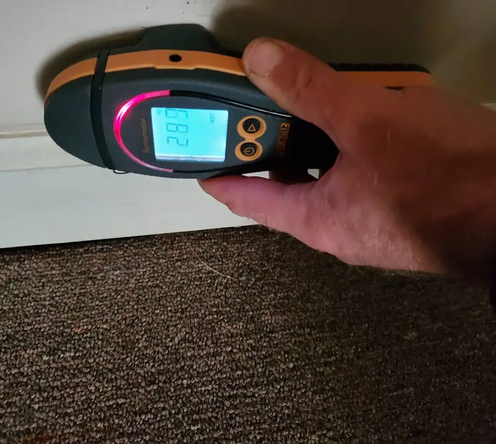 Moisture detection at baseboard during Storm Damage Restoration in Fort Myers